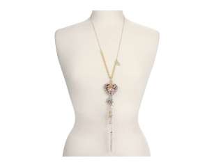 Add breezy style with GUESSs wild romance heart long necklace in 2 