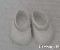 VINTAGE SMALL WHITE VINYL DOLL SHOES PATTERNED FRONT  