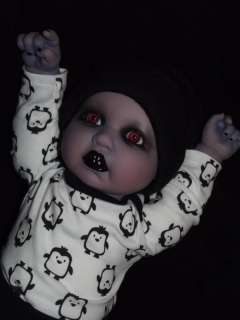 Up for adoption is this adorable demon baby ghoul. She is a one of a 