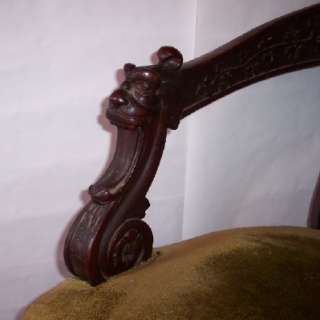 Decoratively Carved Victorian Upholstered Chair   Gargoyle Head Arms 