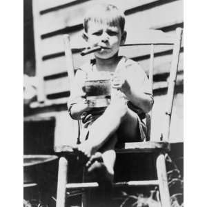   Three and a half year old Gilbert Askew sits in chair