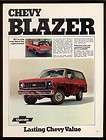1974 red Chevrolet Blazer covered in mud photo vintage print ad