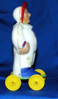 RARE 1950S E ROSEN CLOWN BABY ON WHEELS HARD PLASTIC CANDY CONTAINER 