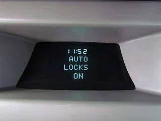 The driver info system displays fuel mileage, a compass, clock 