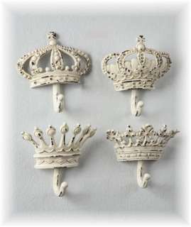  cast iron wall hooks are designed to look like king and queen crowns