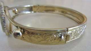 Hinged Bangle Bracelet. Gold Finish, Etched, Cameo Type Color Floral 