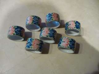 Lot 7 ceramic unused napkin rings white with blue, pink and green 